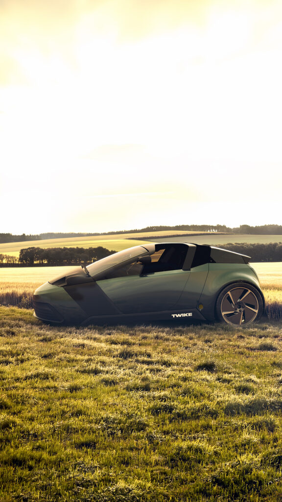 twike five on a grass hill in a sunset light